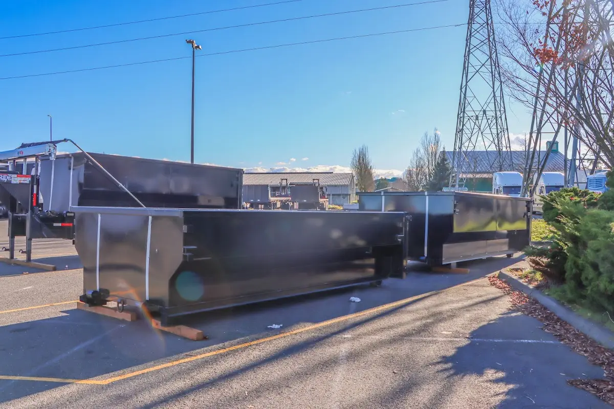 Roll-off dumpster ready for waste disposal at job site for Demolition Dumpster Rental in Northwood